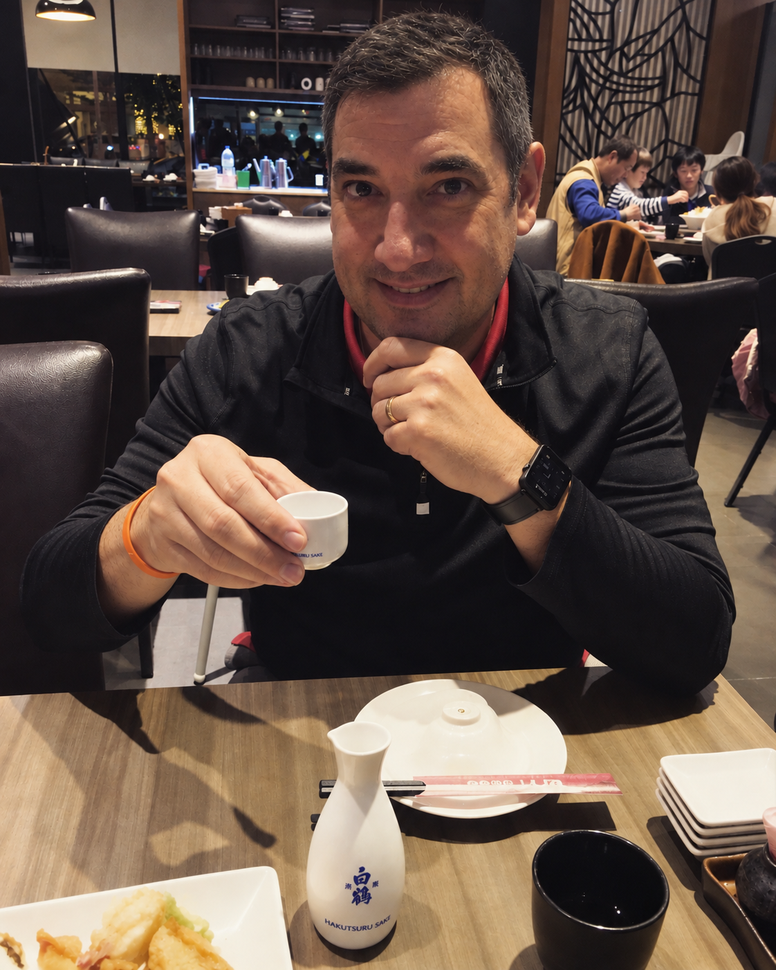 Patrick Maioho holding a tea cup in Taiwan